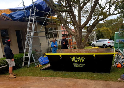 cheapa waste skip bin being put to use at a home renovation
